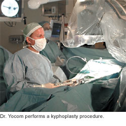 Surgeon performing a kyphoplasty procedure in an operating room.